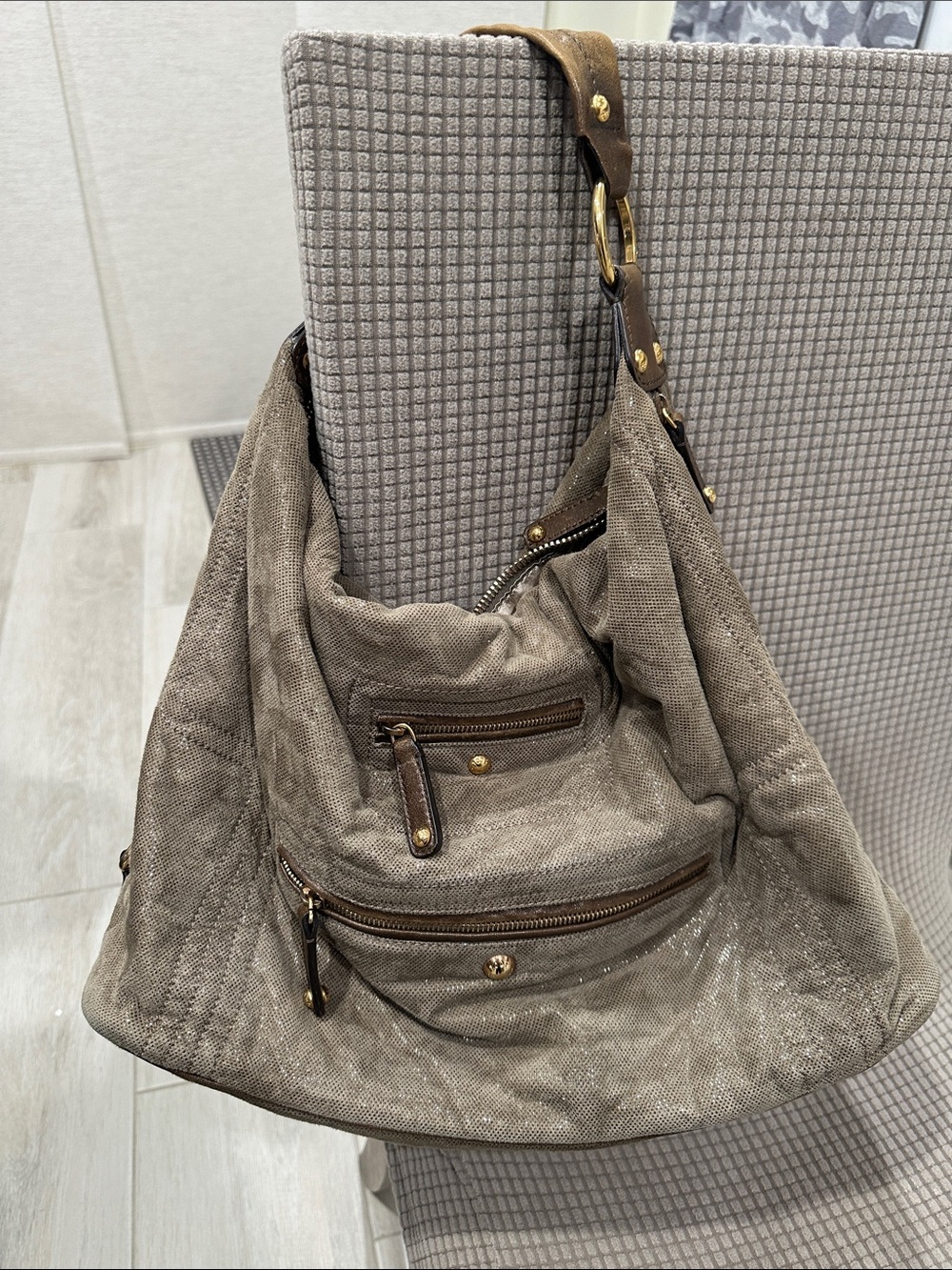 Tod’s Soft Metallic Taupe Hobo Bag with Gold Hardware. Lots of pockets,